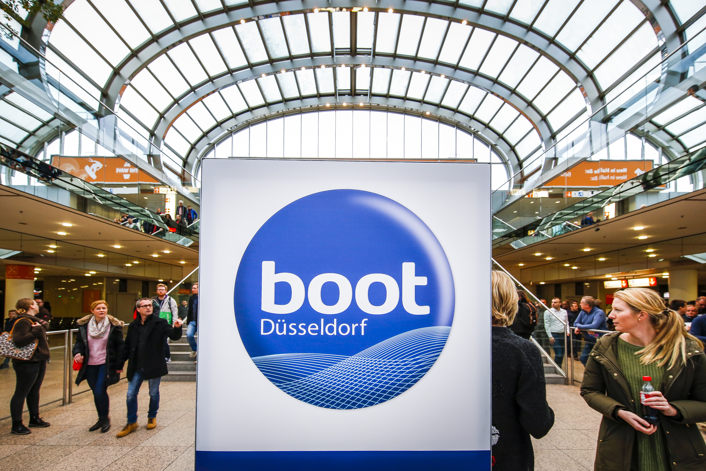 boot Dusseldorf image if logo and people walking in the background.