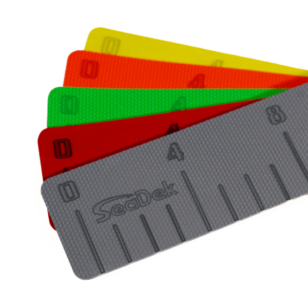 An image showing multiple color variations of the SeaDek Fish Ruler.