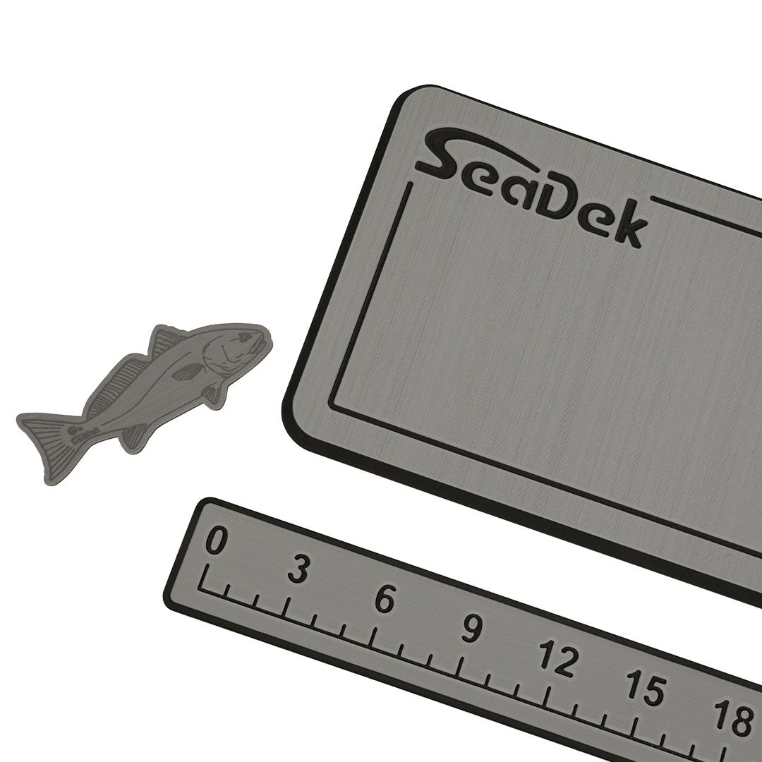 The SeaDek Angler's Bundle, featuring a Hook-n-It pad, a Routed Fish Ruler, and a Small Helm Pad.