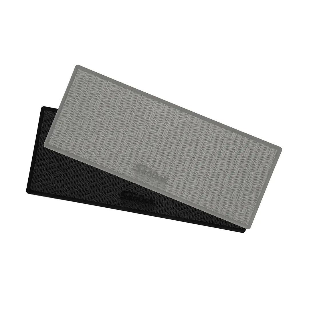 An image of two 19" x 7.5" SeaDek RV Step Covers in Storm Gray and Black.